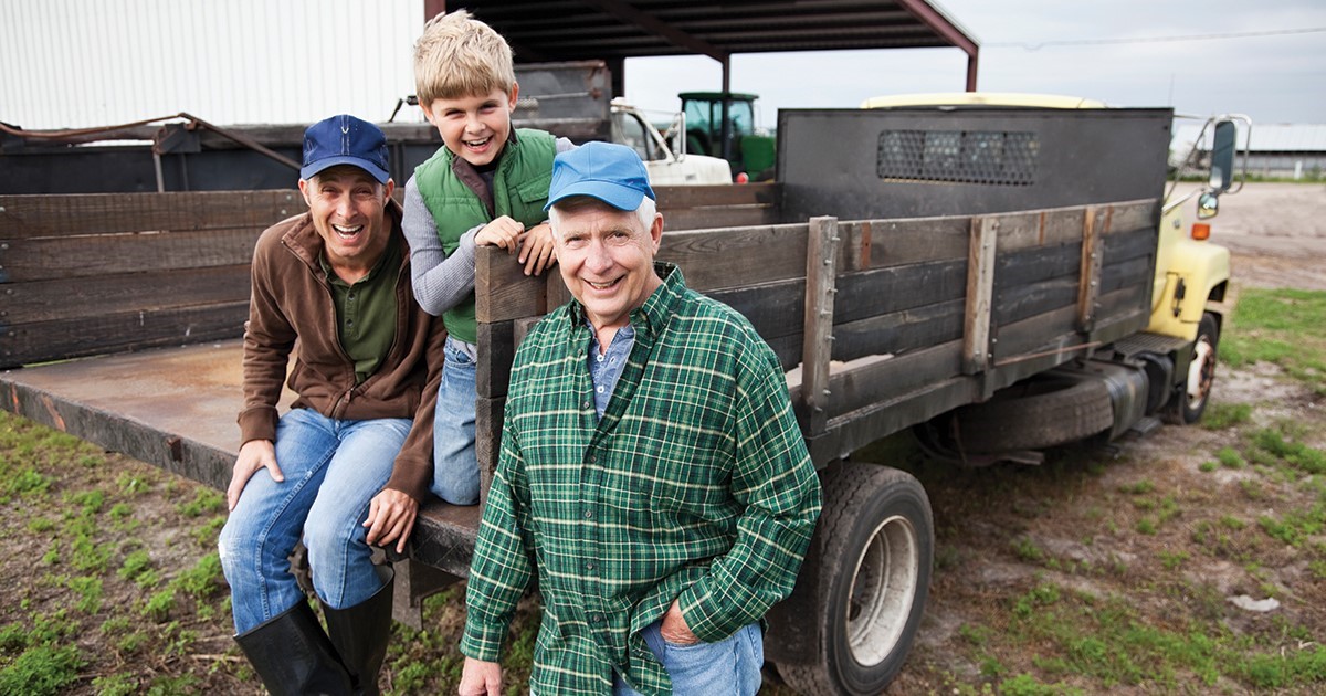 Farmer standing by his truck